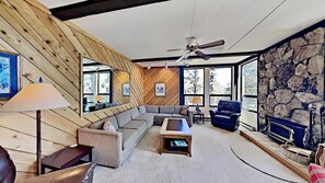 Cozy Living Room Overlooking A Forested Area