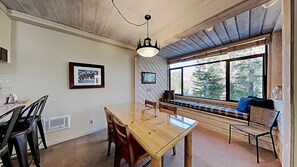 Full Size Dining Room with Bar Seating and Window Seating
