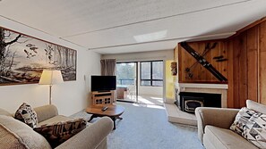 Full-Size Living Area with View of Sunroom and Mountains