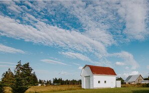 View from the front of the home facing the red roof barn and pastures.