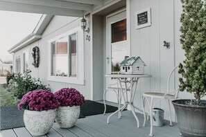 Front porch with bistro table to enjoy a sunrise with your morning coffee. 