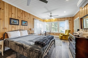 The new master bedroom has a queen-sized bed and wonderful water views