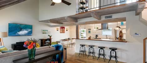 Living room looking into the Kitchen and Dining area~ Ceiling fan~ TV