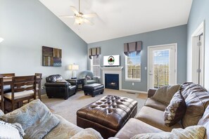 Living Room with Balcony Access, Gas Fireplace, and Cable TV/DVD