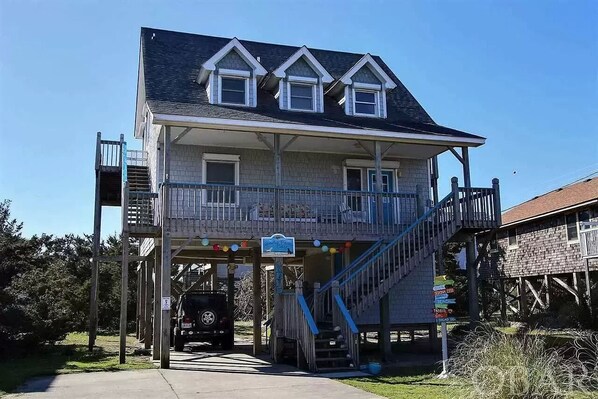 Covered parking and an outdoor hot/cold shower after a day at the beach.  