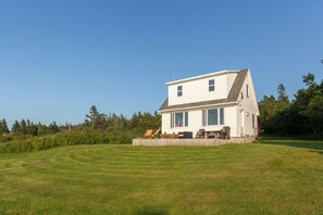Large decking at oceanfront of cottage for your morning coffee enjoyment