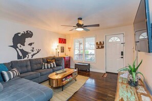 Living Room w/ Bar area, TV with plenty of cable channels, Full size pull out sofa, and games!