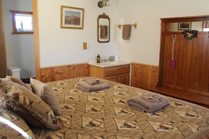 Large king bed with in room sink.