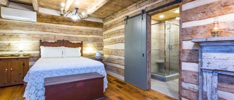 Bed and Barn door to bathroom