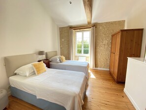 Upstairs twin room with its own bathroom across the corridor.