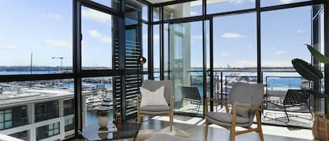 Breathtaking water views from both sides of the living room - perfect for the upcoming America's Cup!