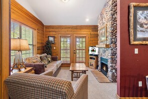 Comfortable Living Room with a Seasonal Gas Fireplace, Cable TV, and Sofa Bed