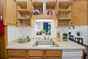 Our kitchen has everything you need for feasting on carry out or cooking a gourmet meal.