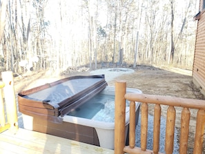 Hot tub with fire pit nearby