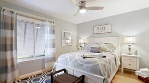 Spacious and inviting, this queen bedroom features a plush queen-sized bed, offering comfort and style for a restful night’s sleep in a beautifully designed space.