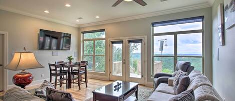 Hardwood floors and giant windows complete the living room.
