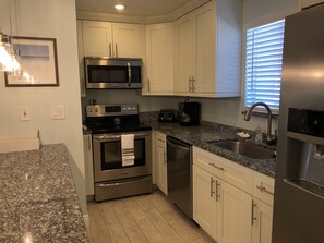Fully stocked, updated kitchen and granite countertops