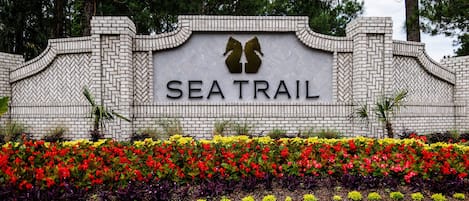 Enter the East Entrance of Sea Trail, closest to Sunset Beach Bridge.