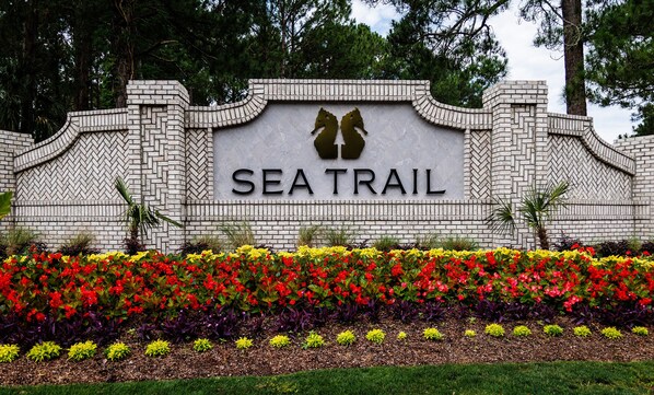 Enter the East Entrance of Sea Trail, closest to Sunset Beach Bridge.