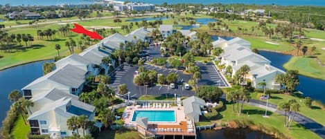 Lakeside Community With Pool in Foreground & 5575 Marked Red Arrow