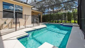 Dive into your private pool oasis, surrounded by lush greenery and total privacy.