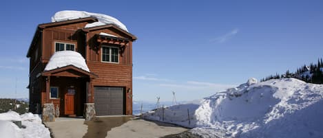 The ski run is directly to the right of the garage door!