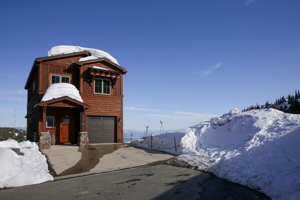 The ski run is directly to the right of the garage door!