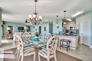 View of dining, kitchen and living room.