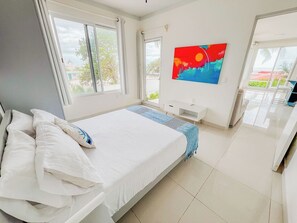 Spacious primary bedroom with lots of light