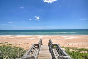 Dig your toes in the sand right across the street!