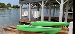 Dock with chair swings and 3 kayaks available to use.