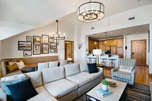 View of dining table and kitchen from living room.