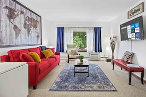 Spacious and bright, the living room offers a comfortable place to relax