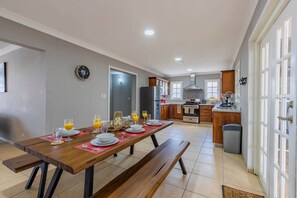 Open concept layout with dining area and kitchen.