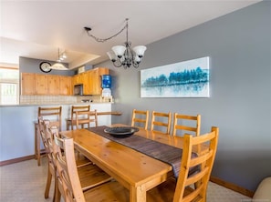 Large dining table with plenty of chairs. 