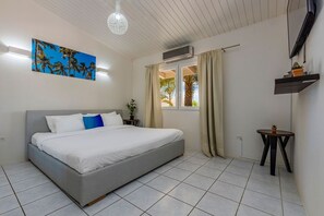 Experience ultimate relaxation in our serene and spacious bedroom