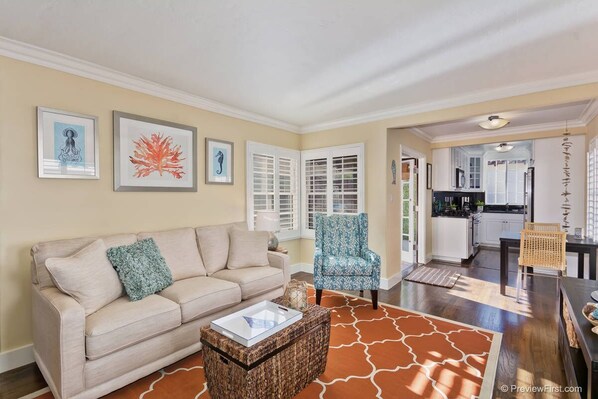 The living room with lots of light and casual coastal decor