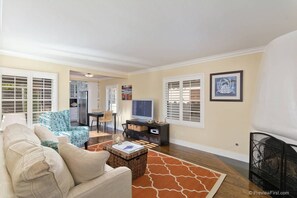 Living room upon entry, looking toward kitchen