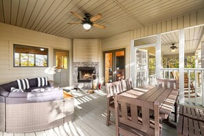 Cozy screened in porch area with outdoor fireplace!