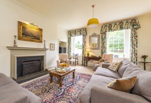 Ground floor: The stylish sitting room with open fire