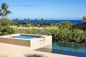 Contemporary design elements delight the senses, like this overflow waterfall from private spa to infinity pool.