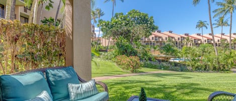 Private lanai with lush tropical views and comfortable outdoor seating