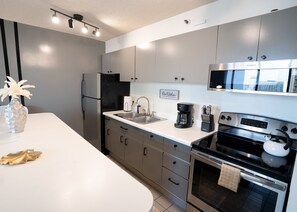 Indoors, Kitchen, Refrigerator, Lamp, Cooktop