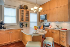 Cook up dinner in the newly renovated kitchen with breakfast bar.