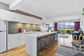 The home features a modern kitchen with plenty of prep space and comes well well-equipped for your holiday catering. 