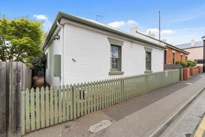 Admire the beautifully restored exterior of this 1835 cottage, a landmark property in the heritage precinct of Battery Point. Enjoy the private courtyard, perfect for a morning coffee or evening relaxation.