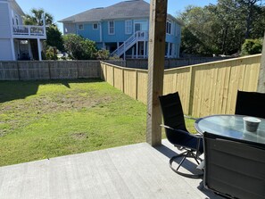 Large backyard with patio table that seats four