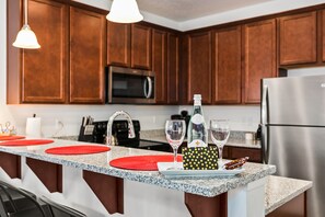 Elegant and functional kitchen with 4-person bar.