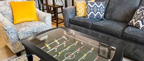 It's a coffee table and a functioning foosball game! No quarters required!