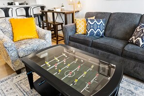 It's a coffee table and a functioning foosball game! No quarters required!